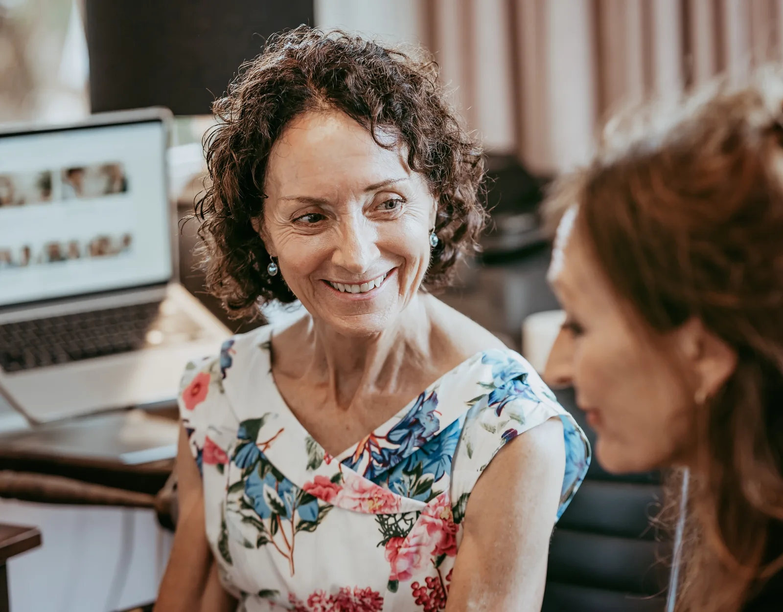 A client smiling during a SPEAK OUT! therapy session with Edwina